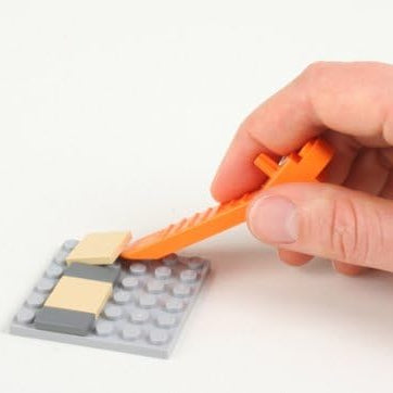 فاصل الأحجار والأجزاء من LEGO باللون البرتقالي